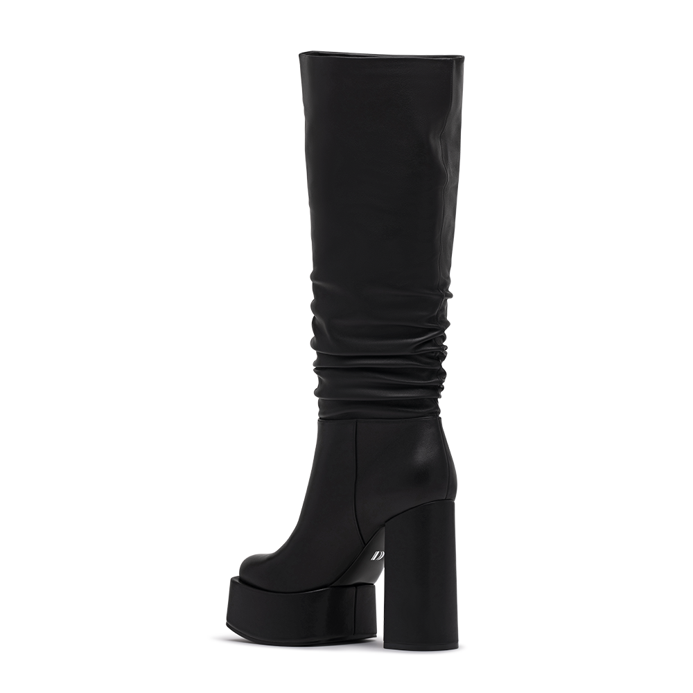 3/4 Side Back View of the Rosela Slouch Platform Heeled Boots in Black